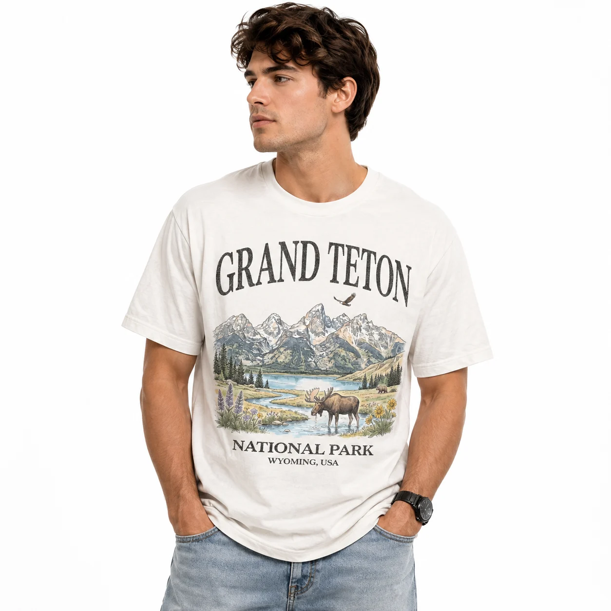 Man wearing a white Grand Teton graphic t-shirt.
