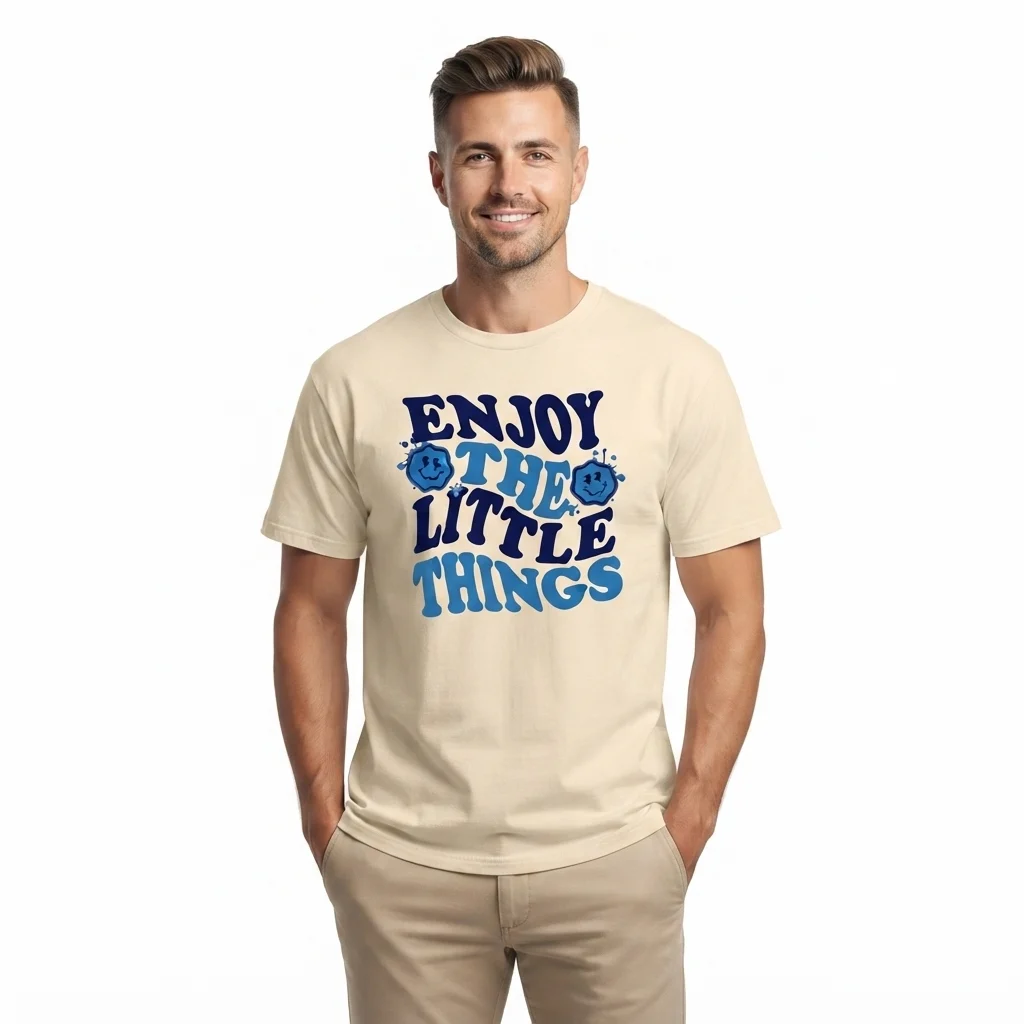 Man wearing cream t-shirt with Enjoy The Little Things graphic